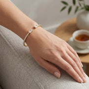 Natural Round Pave Open Cuff Diamond Bangle with Emerald Solitaire Ends in 10K/14K gold and platinum with certified lab-grown or natural diamonds