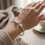 Natural Round Pave Open Cuff Diamond Bangle with Pear Solitaire Ends in 10K/14K gold and platinum with certified lab-grown or natural diamonds