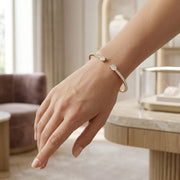 Natural Round Pave Open Cuff Diamond Bangle with Oval Solitaire Ends in 10K/14K gold and platinum with certified lab-grown or natural diamonds
