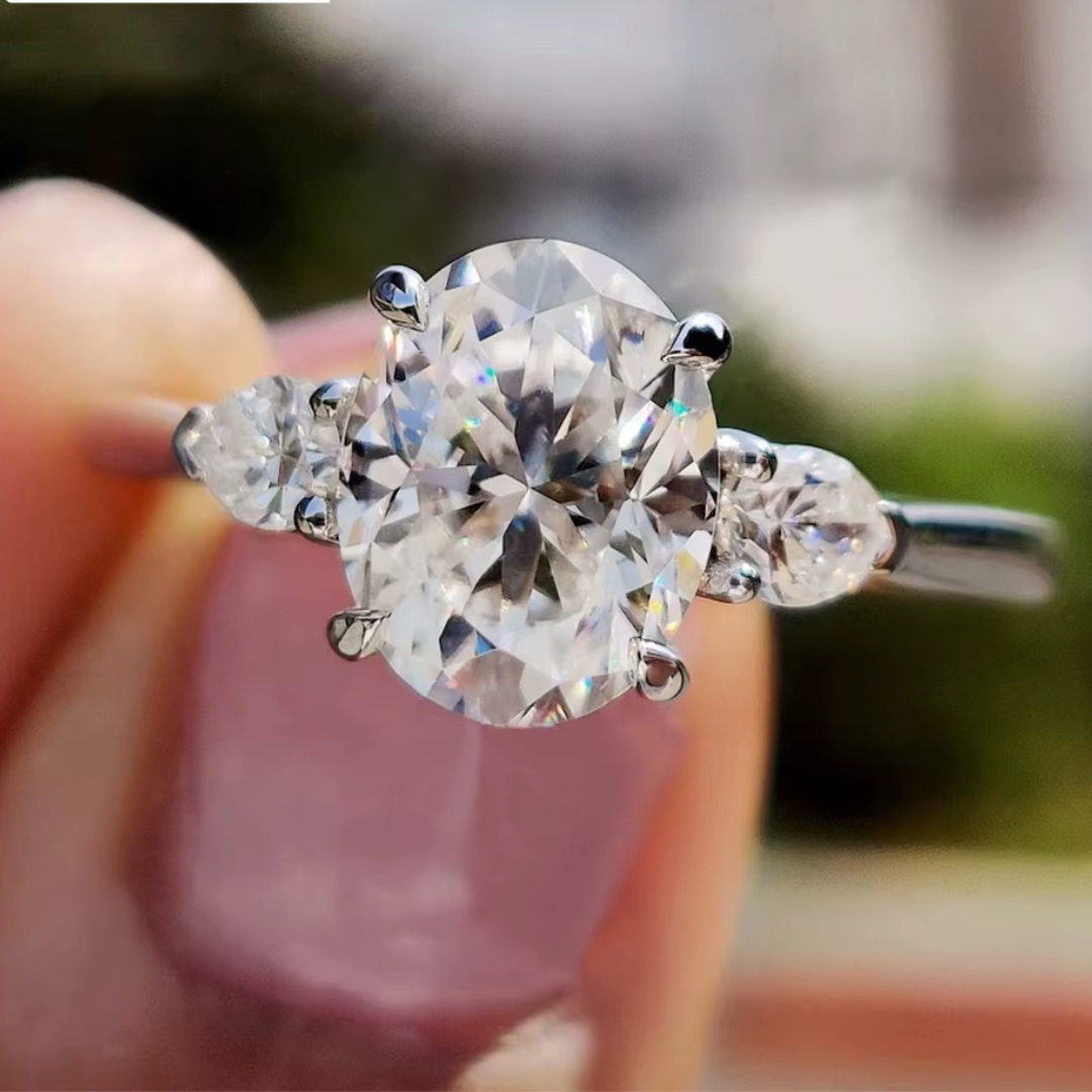Oval Diamond and Pear Diamond Three Stone Engagement Ring in 10K/14K gold and platinum with certified lab-grown or natural diamonds