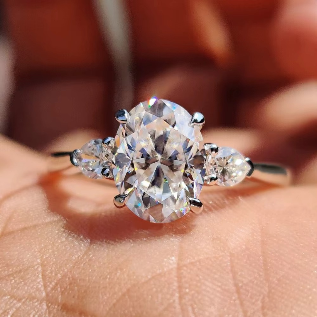 Oval Diamond and Pear Diamond Three Stone Engagement Ring in 10K/14K gold and platinum with certified lab-grown or natural diamonds