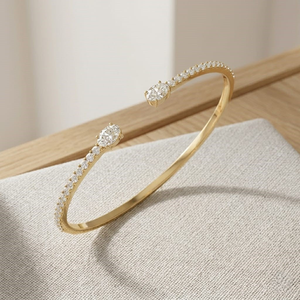 Natural Round Pave Open Cuff Diamond Bangle with Oval Solitaire Ends in 10K/14K gold and platinum with certified lab-grown or natural diamonds