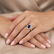 Pear Cut Blue Sapphire Halo Ring with Natural Round Diamond Pave Band in 10K/14K gold and platinum with certified lab-grown or natural diamonds