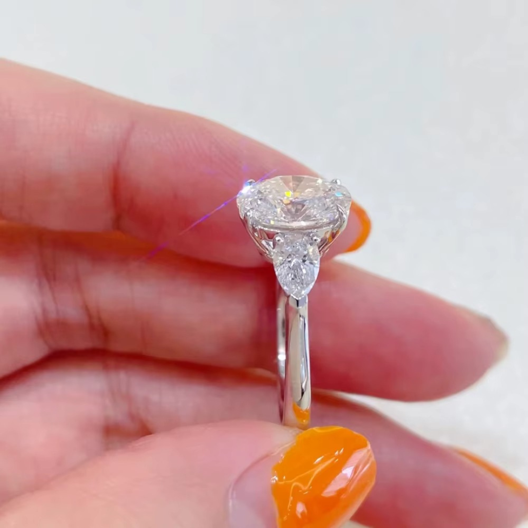 Oval Diamond and Pear Diamond Three Stone Engagement Ring in 10K/14K gold and platinum with certified lab-grown or natural diamonds