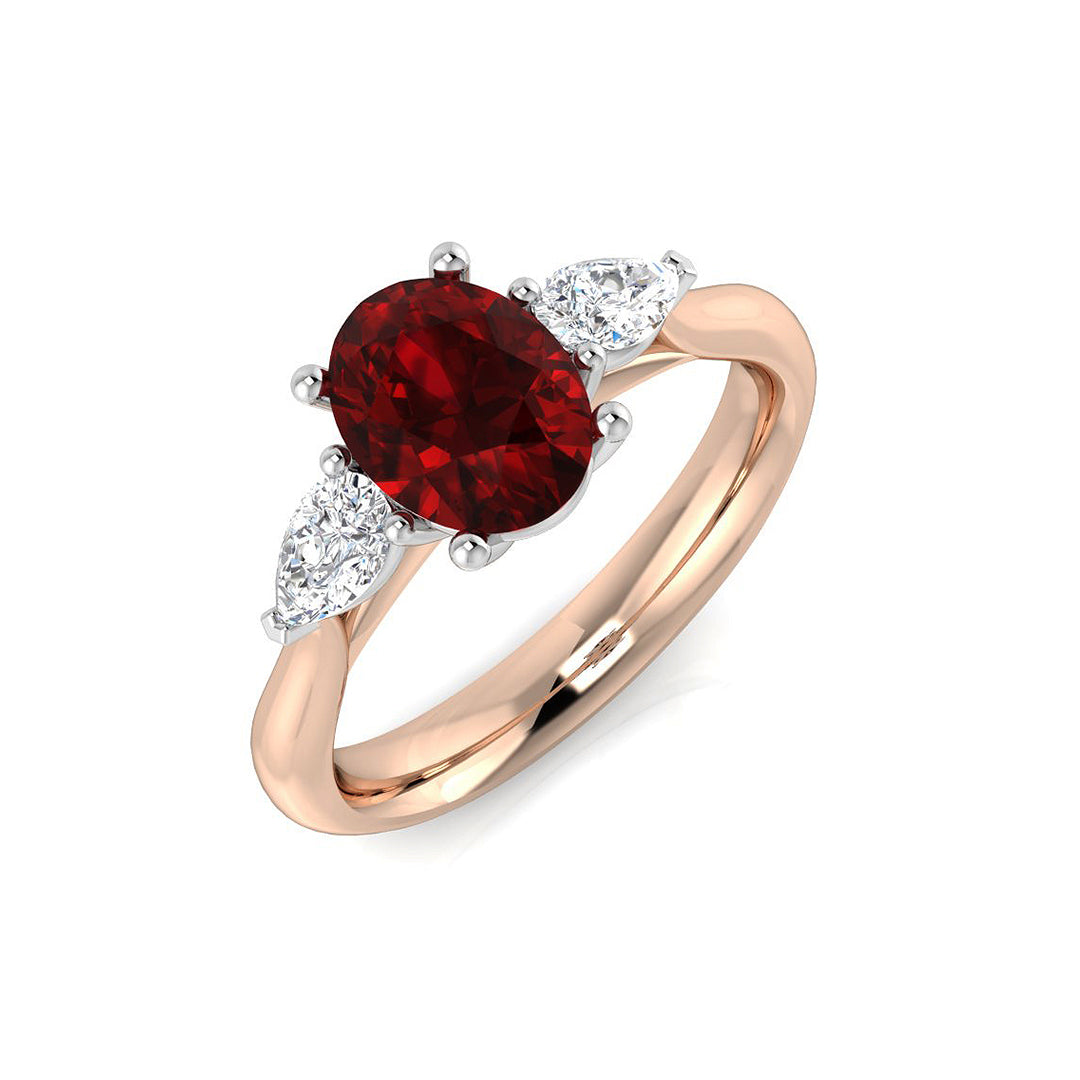 Oval Ruby & Pear Diamond Three Stone Engagement Ring in 10K/14K gold and platinum with certified lab-grown or natural diamonds