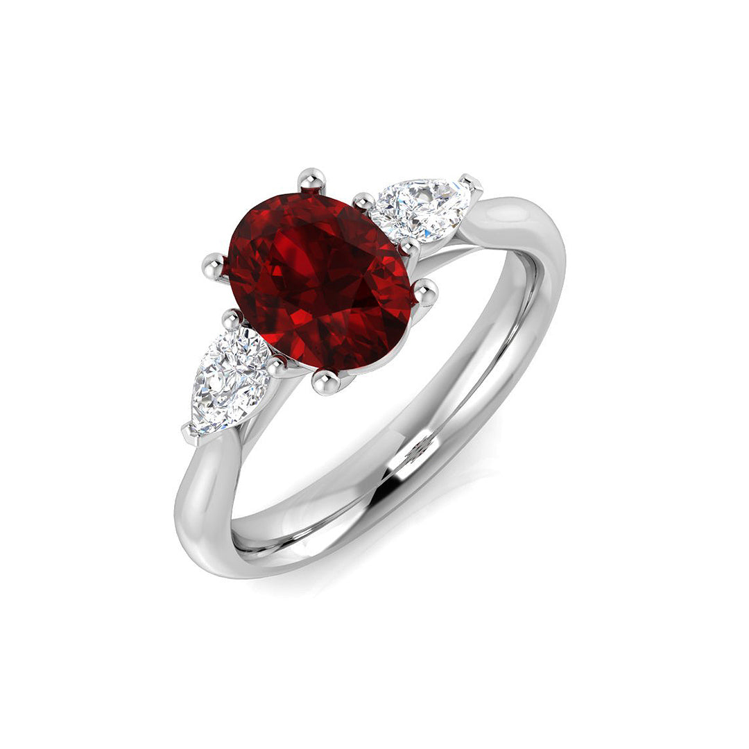 Oval Ruby & Pear Diamond Three Stone Engagement Ring in 10K/14K gold and platinum with certified lab-grown or natural diamonds