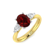 Oval Ruby & Pear Diamond Three Stone Engagement Ring in 10K/14K gold and platinum with certified lab-grown or natural diamonds