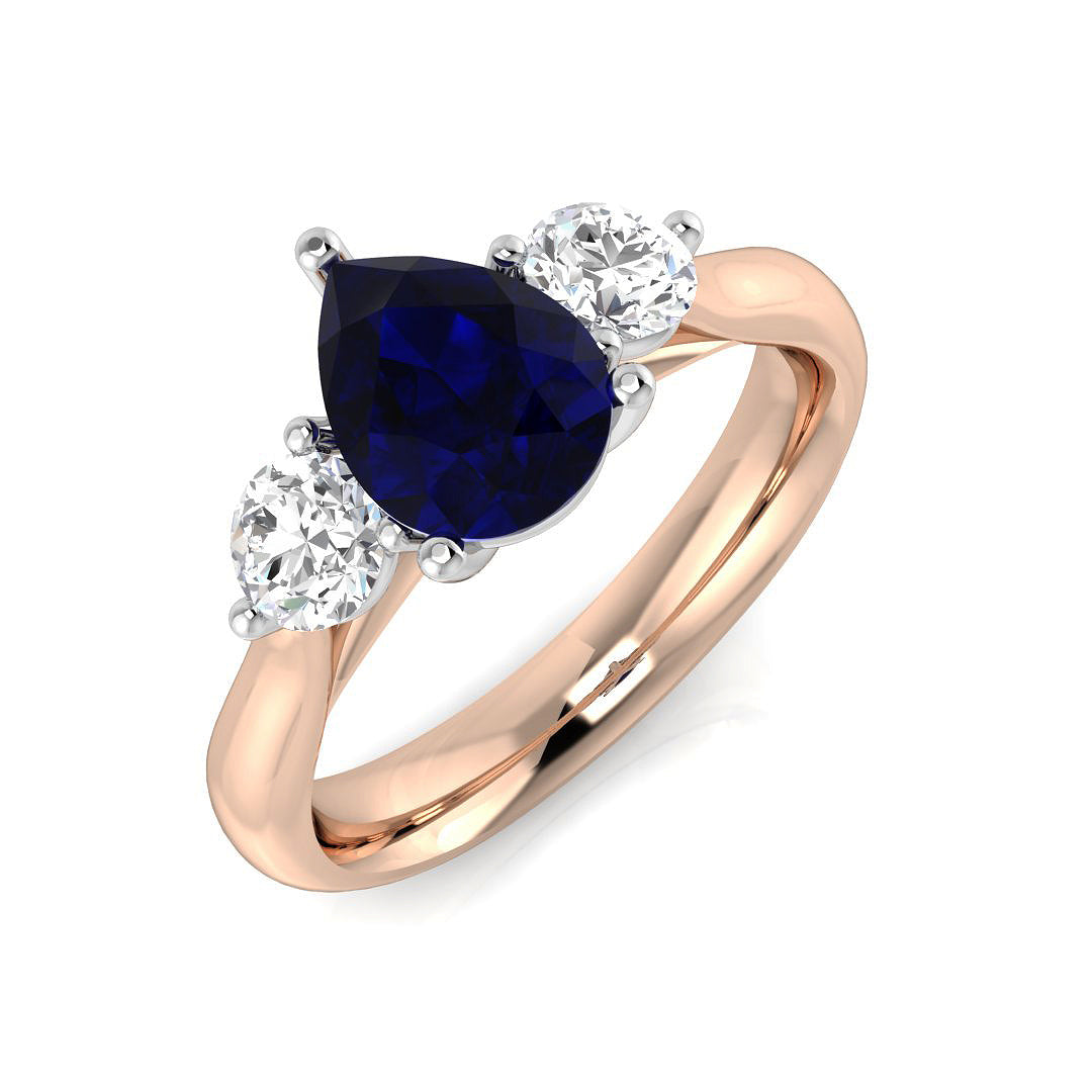 Pear Cut Blue Sapphire Three Stone Ring with Round Side Stones in 10K/14K gold and platinum with certified lab-grown or natural diamonds