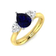 Pear Cut Blue Sapphire Three Stone Ring with Round Side Stones in 10K/14K gold and platinum with certified lab-grown or natural diamonds