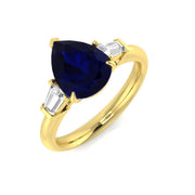 Pear Cut Blue Sapphire Three Stone Ring with Natural Baguette Side Stones in 10K/14K gold and platinum with certified lab-grown or natural diamonds