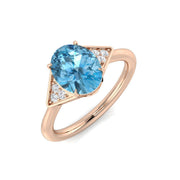 Oval Cut Blue Topaz Ring with Round Side Stones in 10K/14K gold and platinum with certified lab-grown or natural diamonds