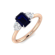 Three Stone Emerald Cut Blue Sapphire Ring with Round Diamond Side Stones in 10K/14K gold and platinum with certified lab-grown or natural diamonds