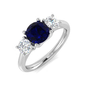 Round Blue Sapphire Three Stone Ring in 10K/14K gold and platinum with certified lab-grown or natural diamonds