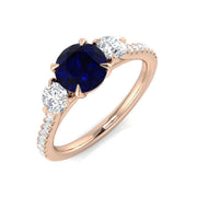Round Blue Sapphire & Oval Diamond Three Stone Ring in 10K/14K gold and platinum with certified lab-grown or natural diamonds