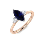 Marquise Blue Sapphire & Round Diamond Three Stone Ring in 10K/14K gold and platinum with certified lab-grown or natural diamonds