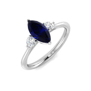 Marquise Blue Sapphire & Round Diamond Three Stone Ring in 10K/14K gold and platinum with certified lab-grown or natural diamonds