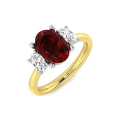 Ruby Three Stone Ring Oval Cut with Diamond Side Stones in 10K/14K gold and platinum with certified lab-grown or natural diamonds