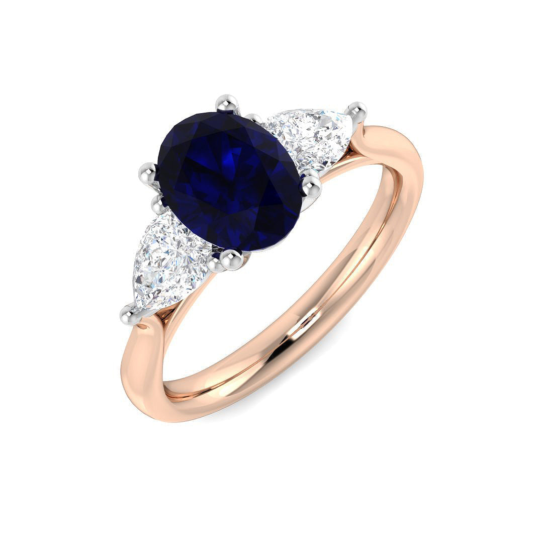 Blue Sapphire Three Stone Ring with Pear Diamond Side Stones in 10K/14K gold and platinum with certified lab-grown or natural diamonds