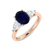 Blue Sapphire Three Stone Ring with Pear Diamond Side Stones in 10K/14K gold and platinum with certified lab-grown or natural diamonds