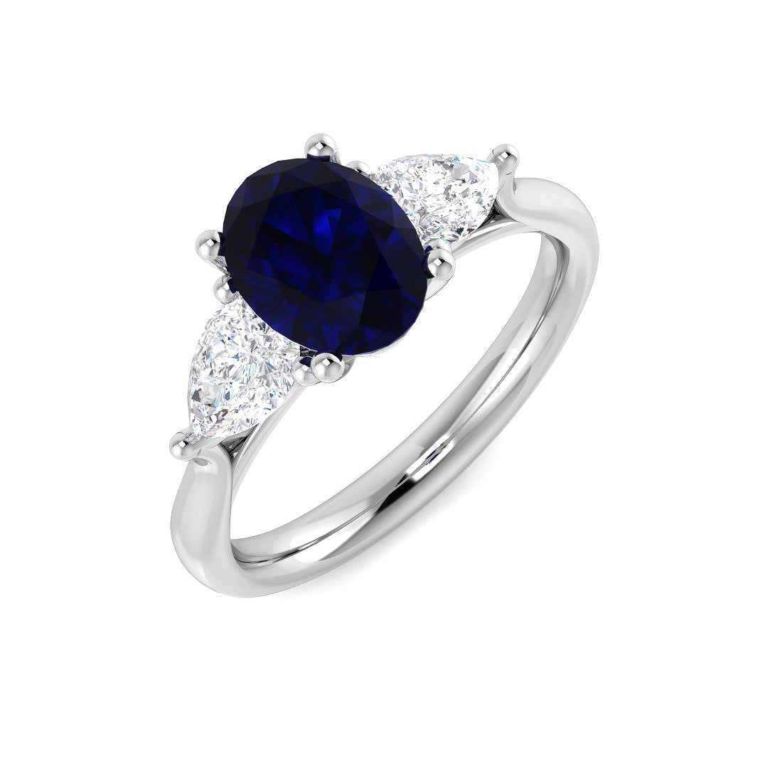 Blue Sapphire Three Stone Ring with Pear Diamond Side Stones in 10K/14K gold and platinum with certified lab-grown or natural diamonds