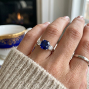 Cushion Cut Blue Sapphire Ring with Natural Round Side Stones Trilogy in 10K/14K gold and platinum with certified lab-grown or natural diamonds