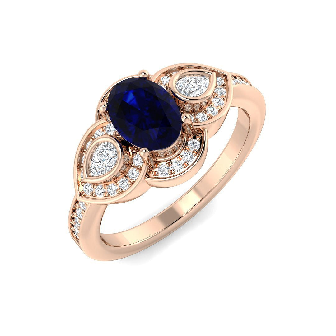 Oval Blue Sapphire Three Stone Ring with Pear Diamond Halo Accents in 10K/14K gold and platinum with certified lab-grown or natural diamonds