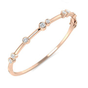 Natural Round Cut Diamond Bezel Set Bubble Bangle for Women in 10K/14K gold and platinum with certified lab-grown or natural diamonds