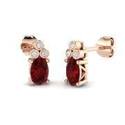 Oval Ruby with Natural Round Diamond Studs in 10K/14K gold and platinum with certified lab-grown or natural diamonds