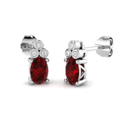 Oval Ruby with Natural Round Diamond Studs in 10K/14K gold and platinum with certified lab-grown or natural diamonds