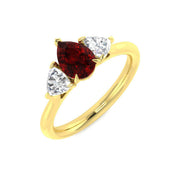 Ruby Trilogy Ring with Pear Cut Ruby & Trillion Diamond Side Stones in 10K/14K gold and platinum with certified lab-grown or natural diamonds