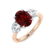 Ruby Three Stone Ring with Oval Cut & Diamond Side Stones in 10K/14K gold and platinum with certified lab-grown or natural diamonds