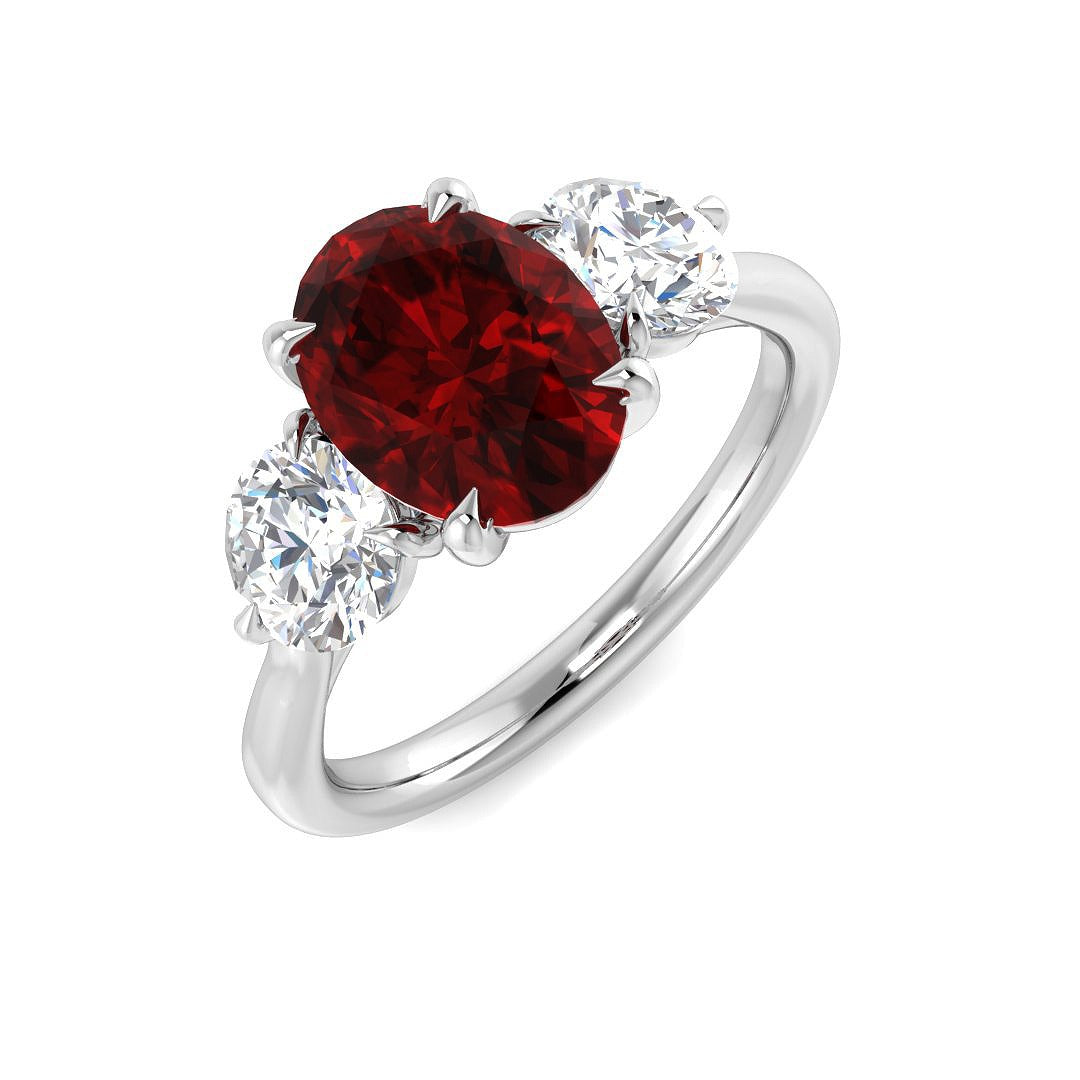 Ruby Three Stone Ring with Oval Cut & Diamond Side Stones in 10K/14K gold and platinum with certified lab-grown or natural diamonds