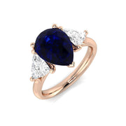 Pear Cut Blue Sapphire Ring with Trillion Cut Side Stone Trilogy Ring in 10K/14K gold and platinum with certified lab-grown or natural diamonds