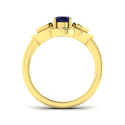 Oval Blue Sapphire Three Stone Ring with Pear Diamond Halo Accents in 10K/14K gold and platinum with certified lab-grown or natural diamonds