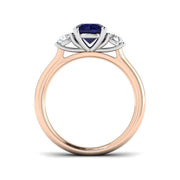 Round Blue Sapphire Three Stone Ring in 10K/14K gold and platinum with certified lab-grown or natural diamonds