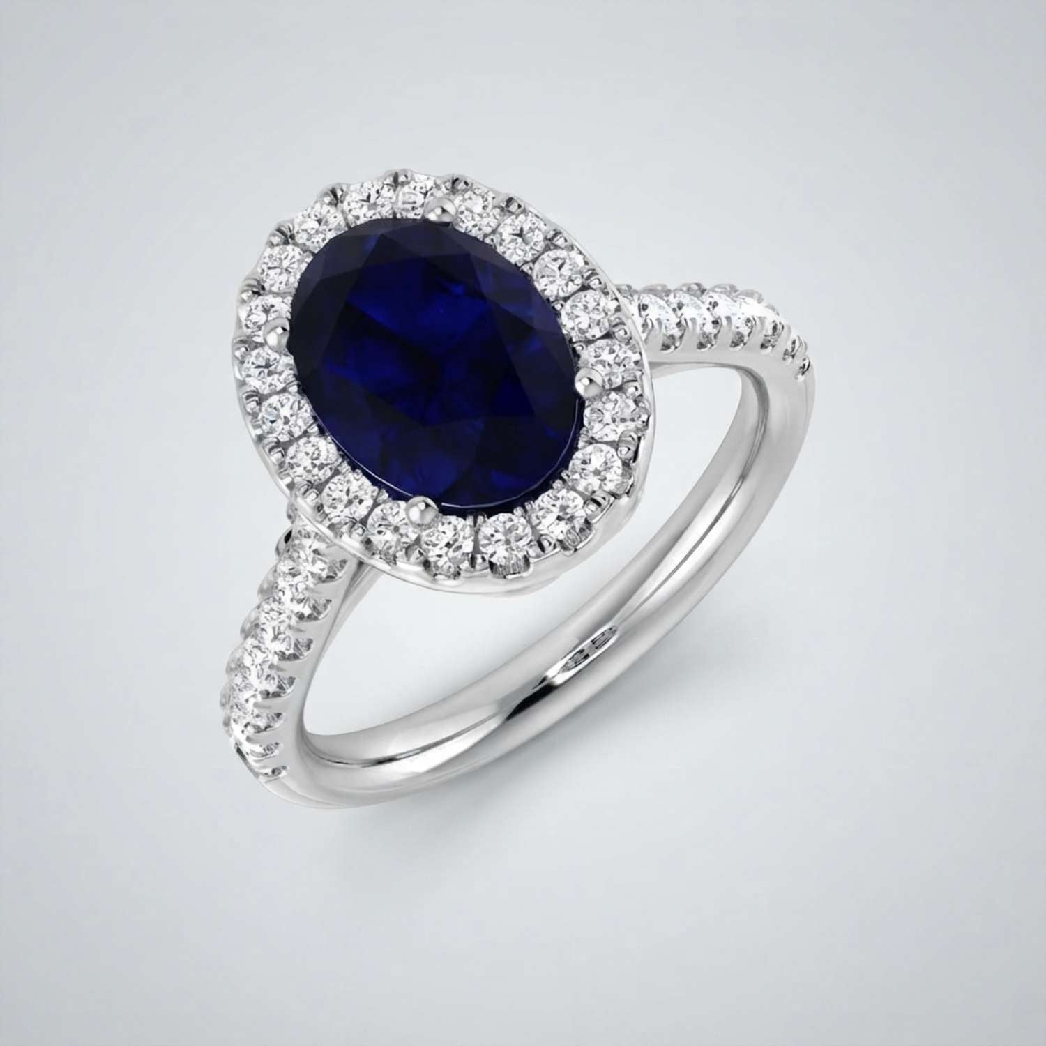 Oval Blue Sapphire Halo Ring with Pave Natural Diamond Band in 10K/14K gold and platinum with certified lab-grown or natural diamonds