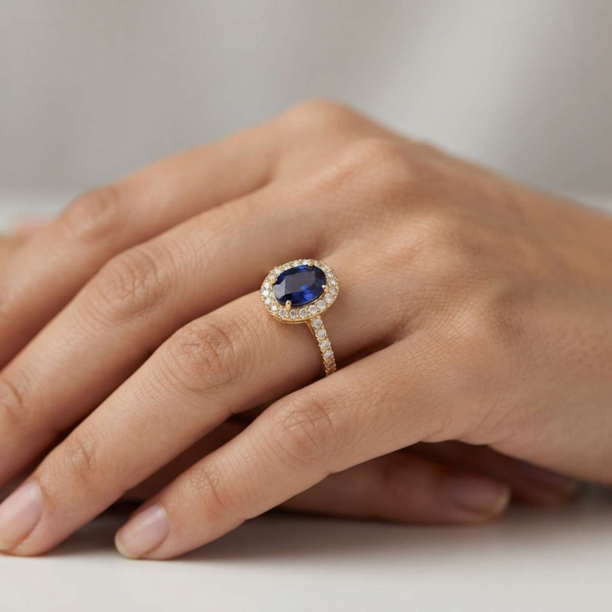Oval Blue Sapphire Halo Ring with Pave Natural Diamond Band in 10K/14K gold and platinum with certified lab-grown or natural diamonds