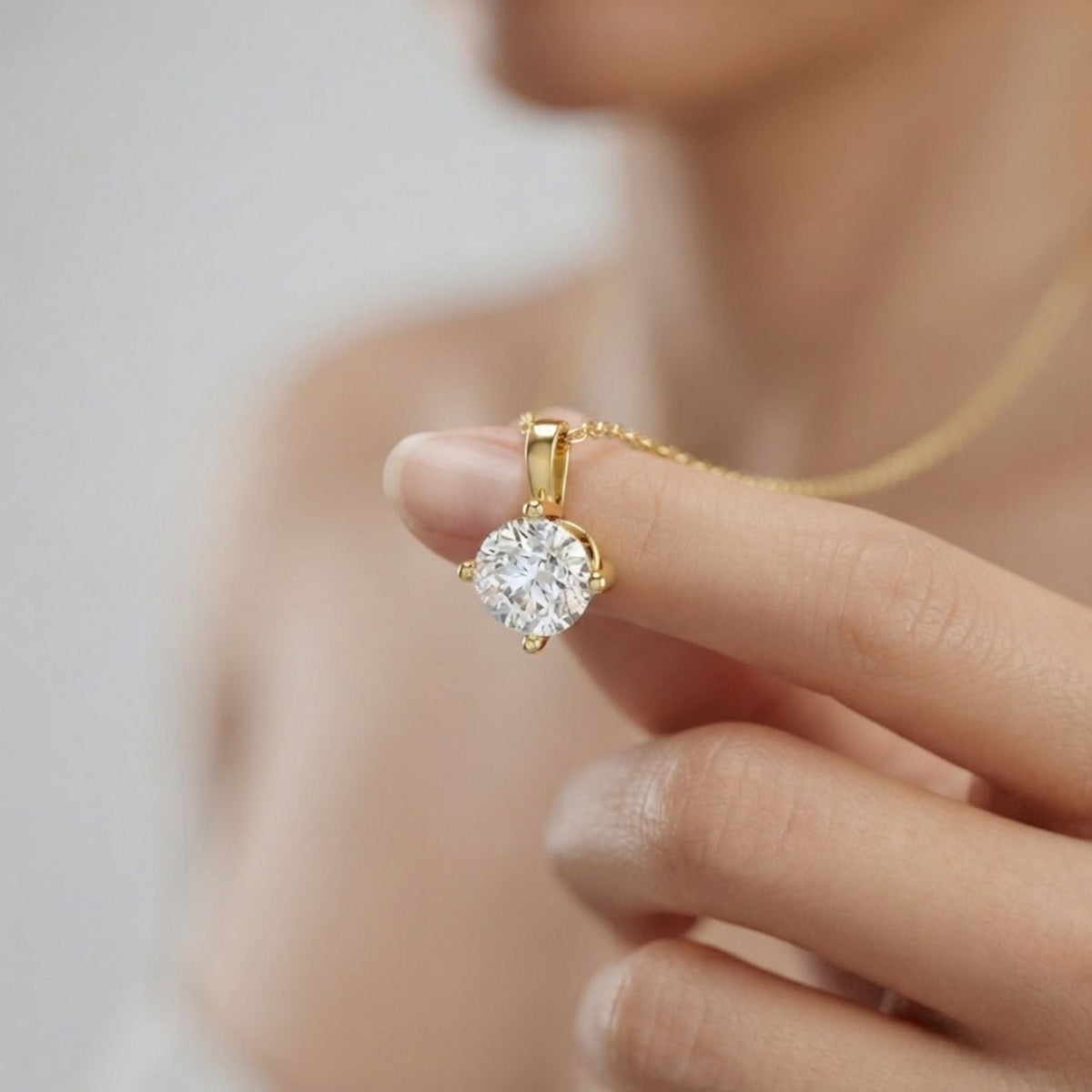 Round Diamond Solitaire Pendant in 10K/14K gold and platinum with certified lab-grown or natural diamonds